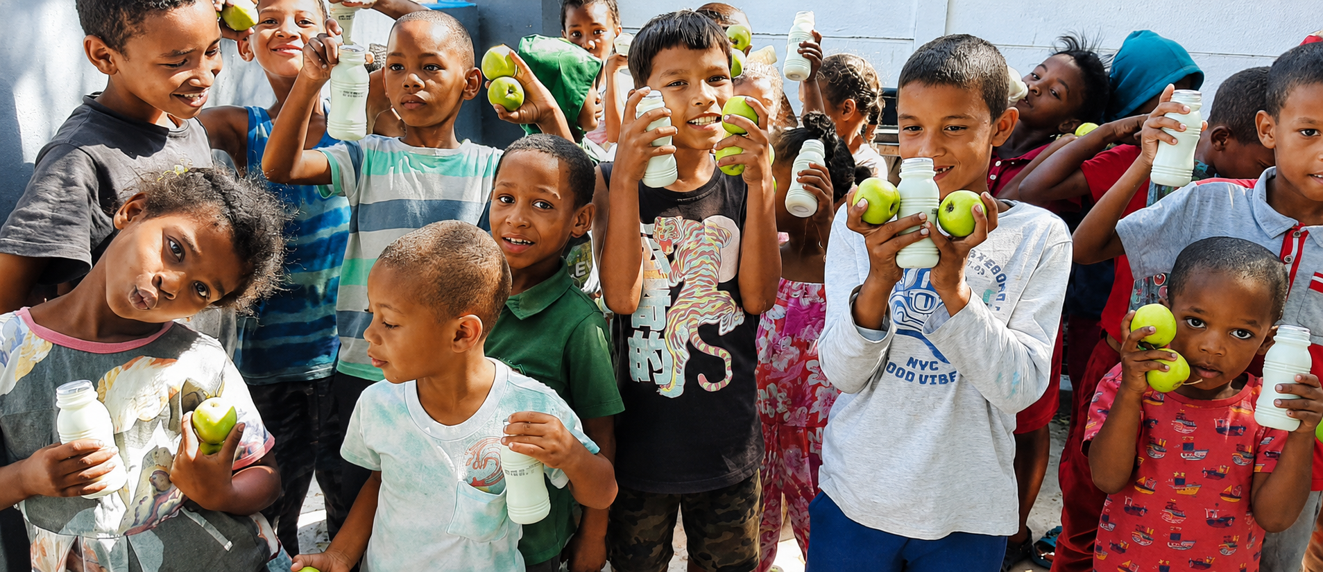 Children sharing a nourishing meal at Shaylex